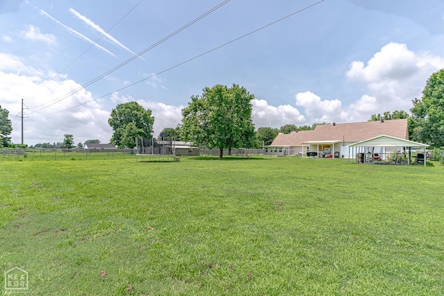13326 Dixie Ln, Trumann, AR 72472 - view of yard with a trampoline