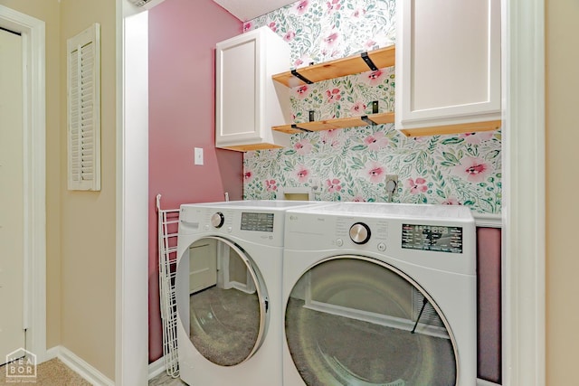 13326 Dixie Ln, Trumann, AR 72472 - washroom featuring cabinet space, washing machine and clothes dryer, and wallpapered walls