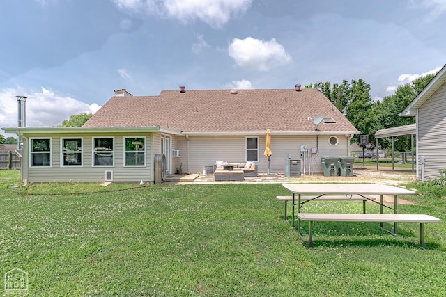 13326 Dixie Ln, Trumann, AR 72472 - back of property with an outdoor hangout area, a lawn, a patio, and roof with shingles