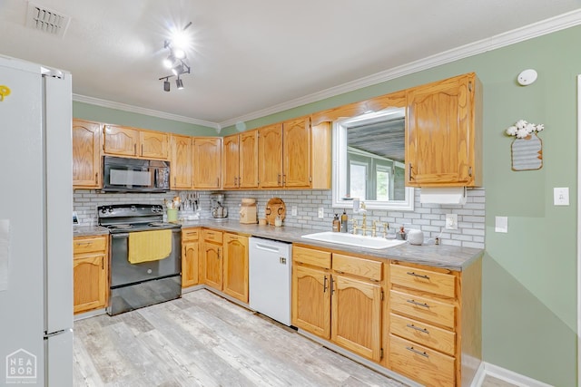 13326 Dixie Ln, Trumann, AR 72472 - kitchen with black appliances, light wood-style floors, backsplash, ornamental molding, and light countertops