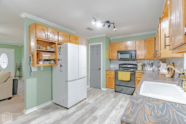 13326 Dixie Ln, Trumann, AR 72472 - kitchen featuring black appliances, ornamental molding, tasteful backsplash, light wood-style flooring, and light countertops