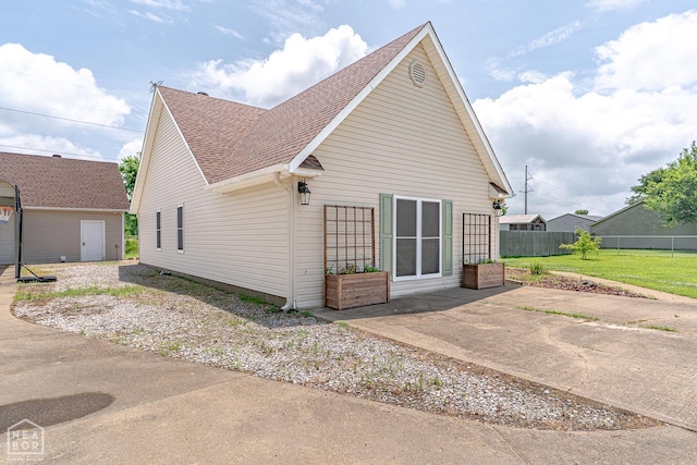 13326 Dixie Ln, Trumann, AR 72472 - back of property featuring roof with shingles and a patio