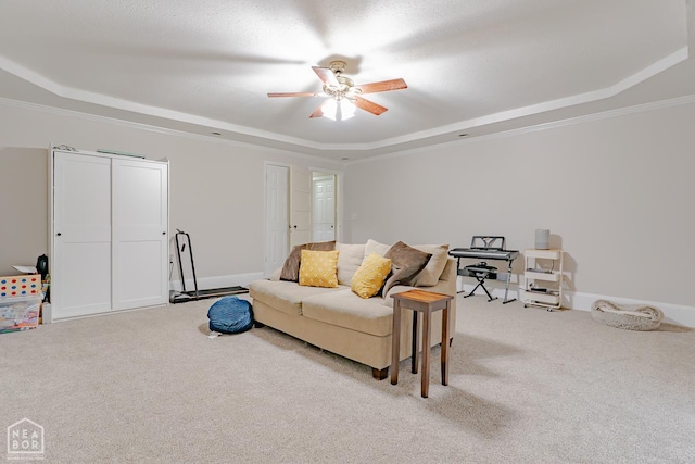 13326 Dixie Ln, Trumann, AR 72472 - living area with a raised ceiling, carpet flooring, ceiling fan, and crown molding