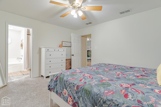 13326 Dixie Ln, Trumann, AR 72472 - carpeted bedroom featuring a ceiling fan and ensuite bathroom