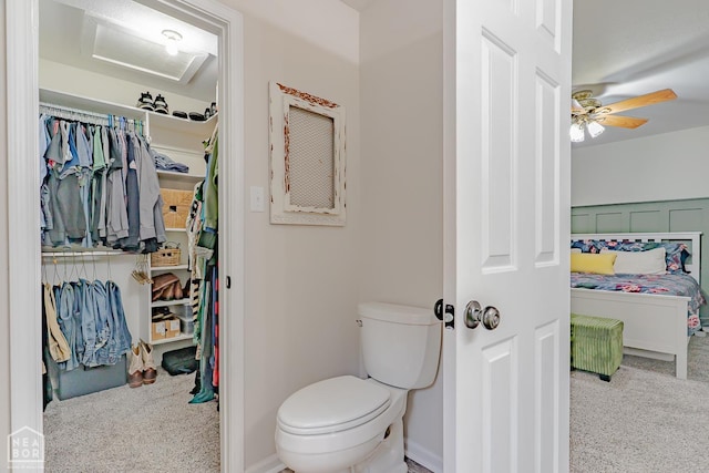 13326 Dixie Ln, Trumann, AR 72472 - bathroom with toilet and a ceiling fan