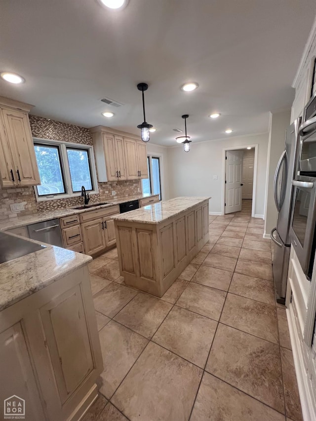 318 Davis St, Manila, AR 72442 - kitchen featuring backsplash, a center island, stainless steel appliances, light stone counters, and recessed lighting