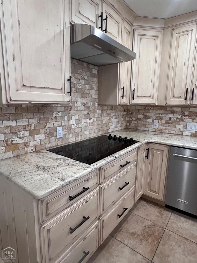 318 Davis St, Manila, AR 72442 - kitchen with stainless steel dishwasher, black electric stovetop, backsplash, and under cabinet range hood