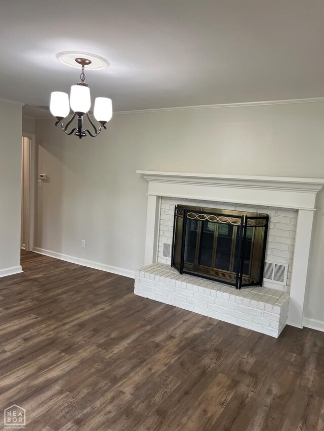 318 Davis St, Manila, AR 72442 - unfurnished living room featuring a fireplace, crown molding, a chandelier, and wood finished floors