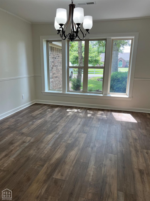 318 Davis St, Manila, AR 72442 - unfurnished dining area featuring a chandelier, dark wood-type flooring, and crown molding