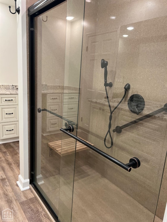318 Davis St, Manila, AR 72442 - bathroom featuring wood finished floors and a shower