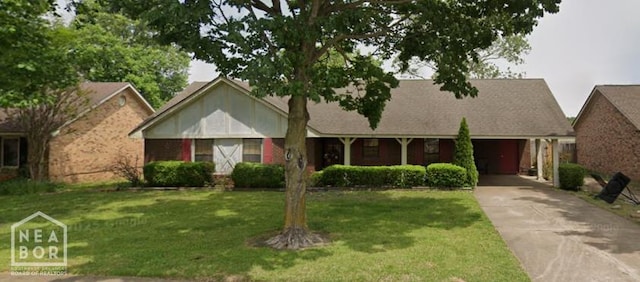 213 E Greenbriar Dr, Osceola, AR 72370 - ranch-style home featuring driveway, a front lawn, and a carport