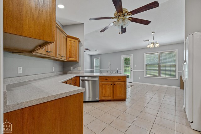 214 Holmes Rd, Jonesboro, AR 72405 - kitchen with dishwasher, freestanding refrigerator, a peninsula, light countertops, and brown cabinetry