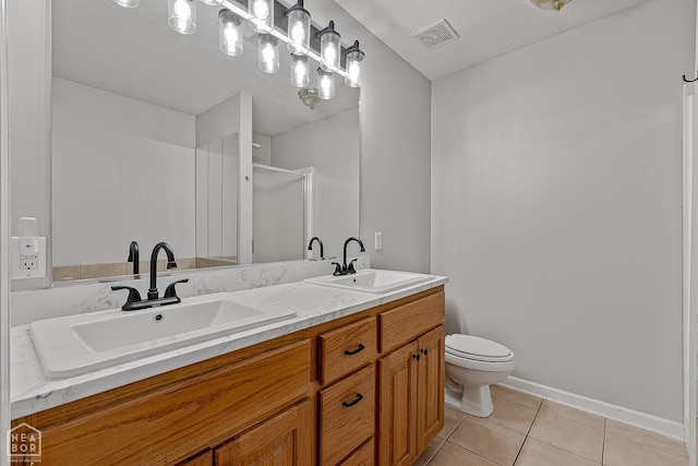 214 Holmes Rd, Jonesboro, AR 72405 - full bathroom with double vanity, tile patterned floors, and a shower with door