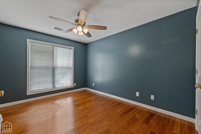 214 Holmes Rd, Jonesboro, AR 72405 - unfurnished room with a ceiling fan and wood finished floors