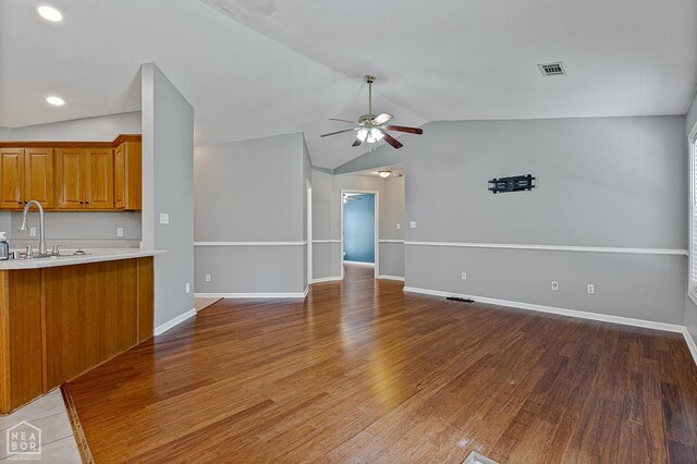 214 Holmes Rd, Jonesboro, AR 72405 - unfurnished living room featuring a ceiling fan, lofted ceiling, light wood-type flooring, and recessed lighting