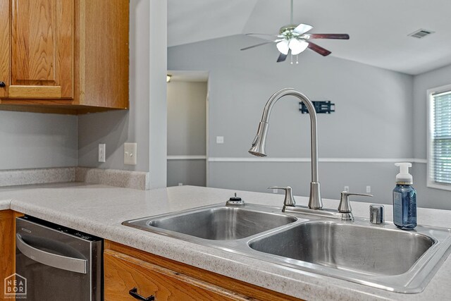 214 Holmes Rd, Jonesboro, AR 72405 - kitchen with stainless steel dishwasher, ceiling fan, light countertops, brown cabinetry, and vaulted ceiling