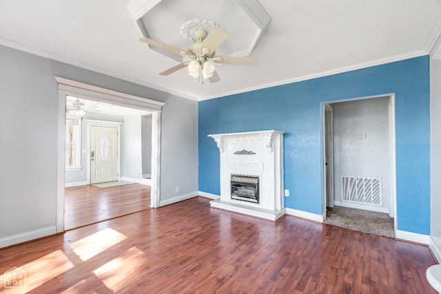 605 SE 2nd St SE, Hoxie, AR 72433 - unfurnished living room featuring ornamental molding, visible vents, a ceiling fan, and wood finished floors