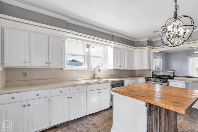 605 SE 2nd St SE, Hoxie, AR 72433 - kitchen with wood counters, range with gas stovetop, and white cabinets