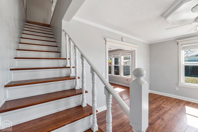 605 SE 2nd St SE, Hoxie, AR 72433 - stairs featuring baseboards, ornamental molding, a textured ceiling, a ceiling fan, and wood finished floors