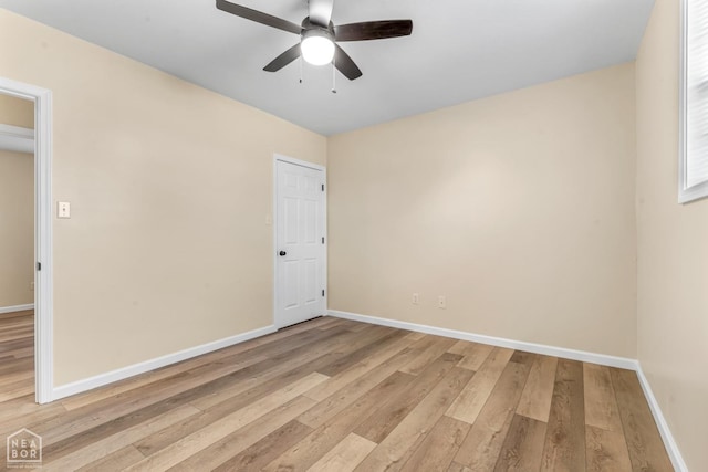 202 S 14th Ave, Paragould, AR 72450 - unfurnished room featuring light wood finished floors, a ceiling fan, and baseboards