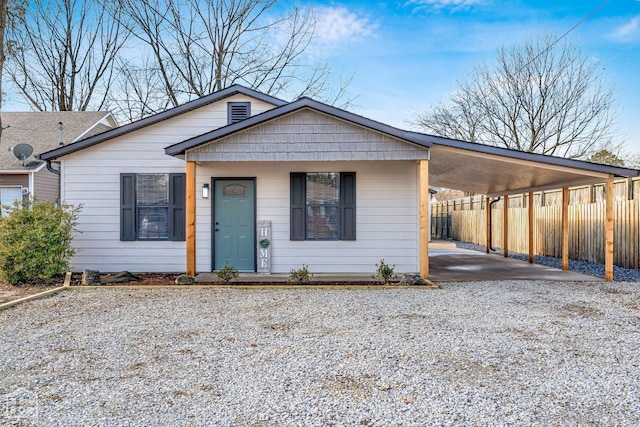 202 S 14th Ave, Paragould, AR 72450 - view of front of house featuring gravel driveway and a carport