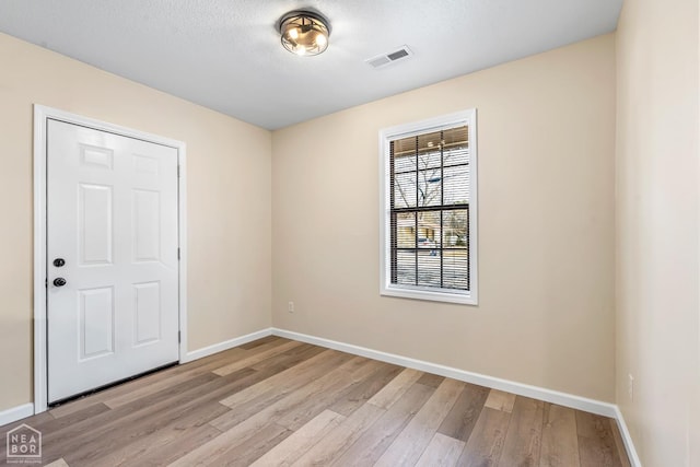 202 S 14th Ave, Paragould, AR 72450 - unfurnished room with light wood-style floors and baseboards