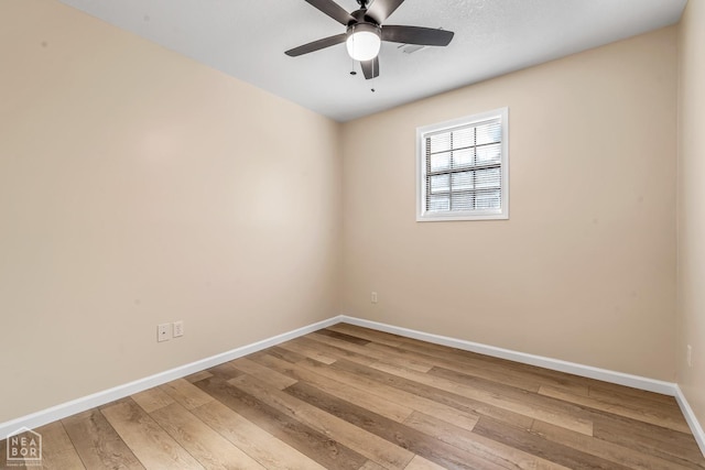 202 S 14th Ave, Paragould, AR 72450 - unfurnished room with light wood-type flooring, baseboards, and a ceiling fan