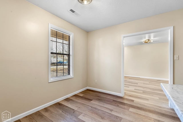 202 S 14th Ave, Paragould, AR 72450 - empty room with light wood-style flooring and baseboards