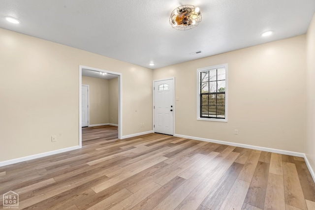 202 S 14th Ave, Paragould, AR 72450 - entrance foyer featuring light wood-type flooring, baseboards, and recessed lighting