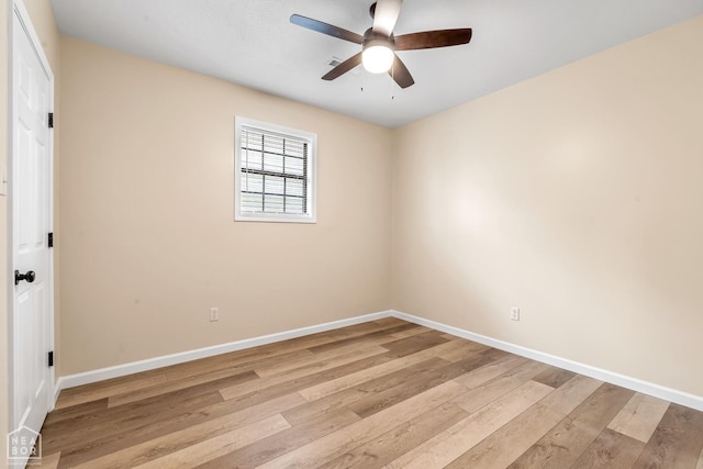 202 S 14th Ave, Paragould, AR 72450 - unfurnished room with light wood-style floors, baseboards, and a ceiling fan