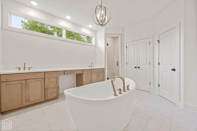 full bath with a soaking tub, recessed lighting, marble finish floor, a sink, and a stall shower