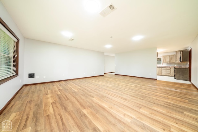 67 Razorback Dr, Hoxie, AR 72433 - unfurnished living room featuring light wood finished floors and baseboards