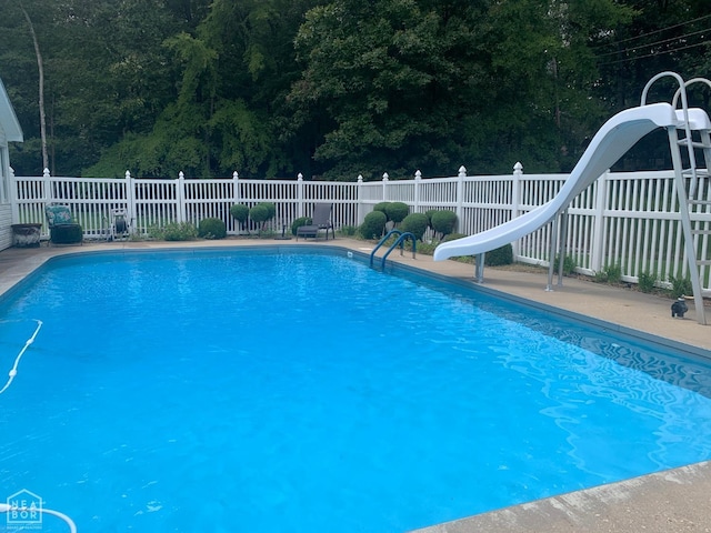 4105 Renee Dr, Jonesboro, AR 72404 - view of pool featuring a water slide and a wooded view