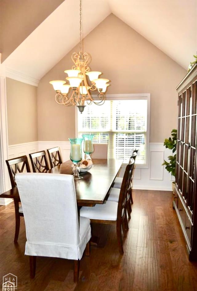 4105 Renee Dr, Jonesboro, AR 72404 - dining space featuring lofted ceiling, dark wood-style flooring, a chandelier, a wainscoted wall, and a decorative wall