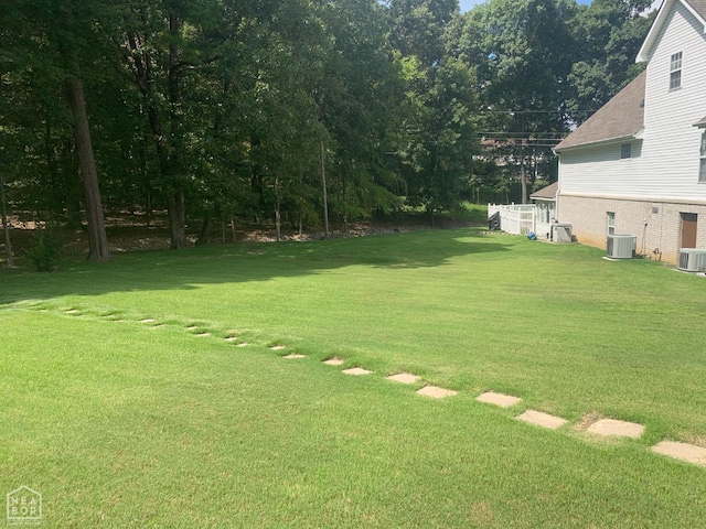 4105 Renee Dr, Jonesboro, AR 72404 - view of grassy yard featuring central AC unit