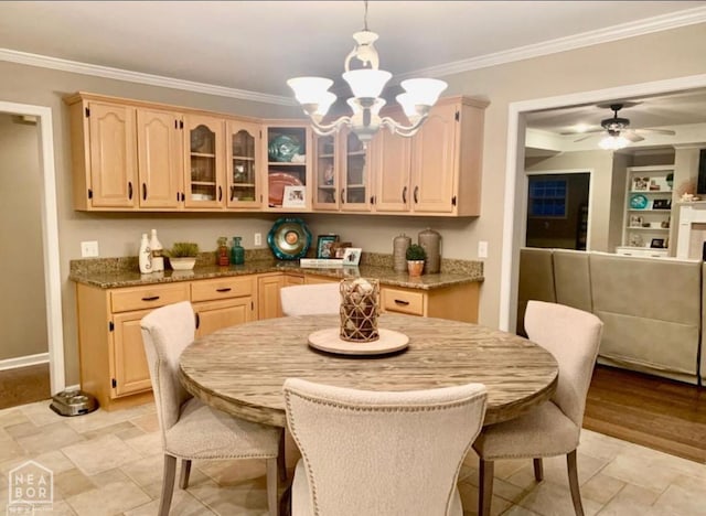 4105 Renee Dr, Jonesboro, AR 72404 - dining room with crown molding, a chandelier, a ceiling fan, light stone finish flooring, and baseboards