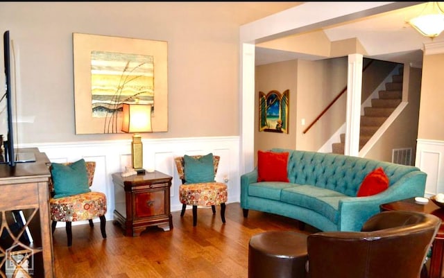 4105 Renee Dr, Jonesboro, AR 72404 - sitting room with wood finished floors, wainscoting, stairway, and a decorative wall