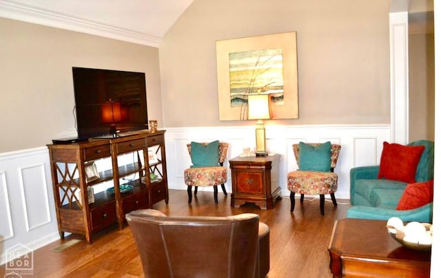 4105 Renee Dr, Jonesboro, AR 72404 - living area with ornamental molding, a wainscoted wall, wood finished floors, vaulted ceiling, and a decorative wall
