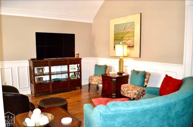 4105 Renee Dr, Jonesboro, AR 72404 - living area featuring ornamental molding, wood finished floors, vaulted ceiling, wainscoting, and a decorative wall
