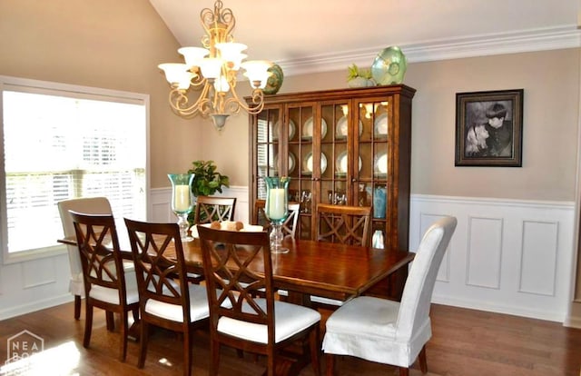 4105 Renee Dr, Jonesboro, AR 72404 - dining space with a decorative wall, a chandelier, wood finished floors, a wainscoted wall, and lofted ceiling