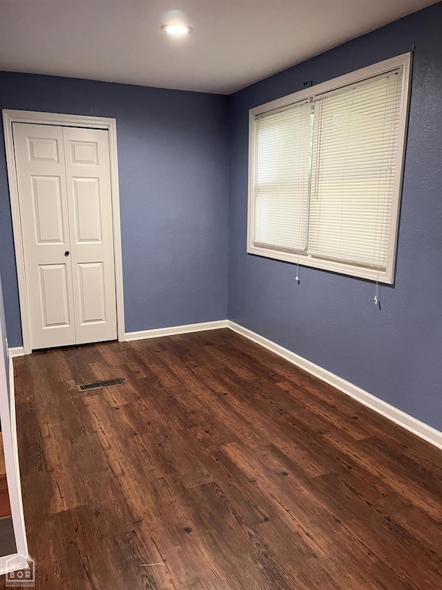 4903 Wise St, Paragould, AR 72450 - unfurnished bedroom with wood finished floors, baseboards, a closet, and recessed lighting