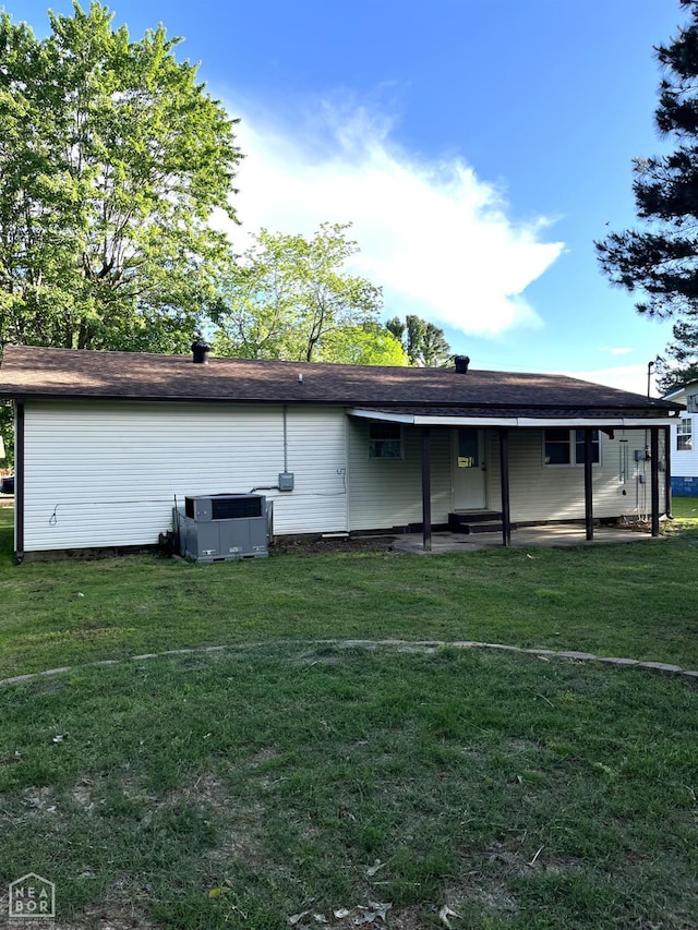 4903 Wise St, Paragould, AR 72450 - back of property with a lawn and central air condition unit