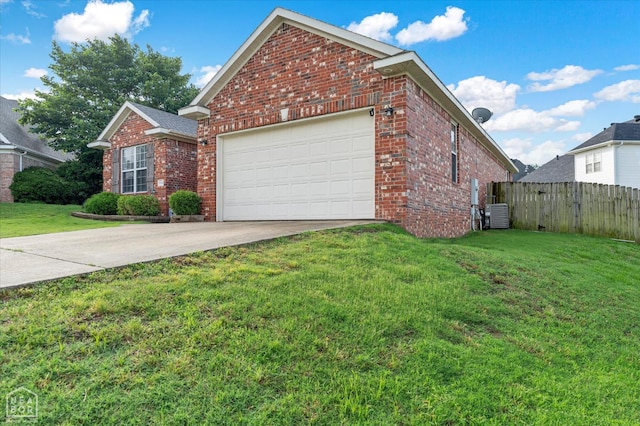 2105 Quarry Cv, Jonesboro, AR 72404 - view of property exterior with brick siding, concrete driveway, a garage, and central AC
