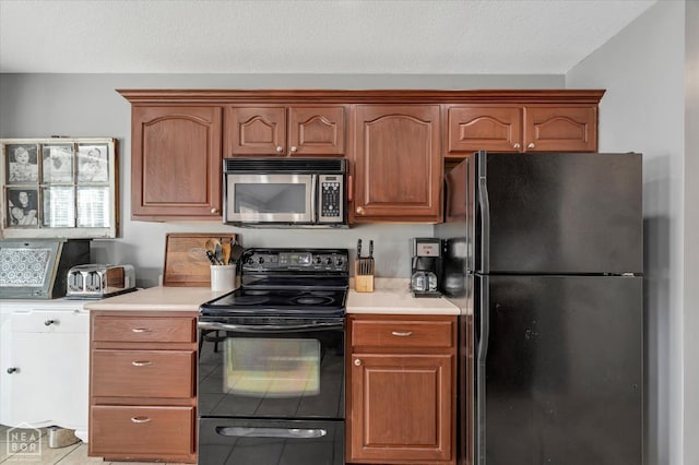 2105 Quarry Cv, Jonesboro, AR 72404 - kitchen featuring black appliances, light countertops, and light tile patterned floors
