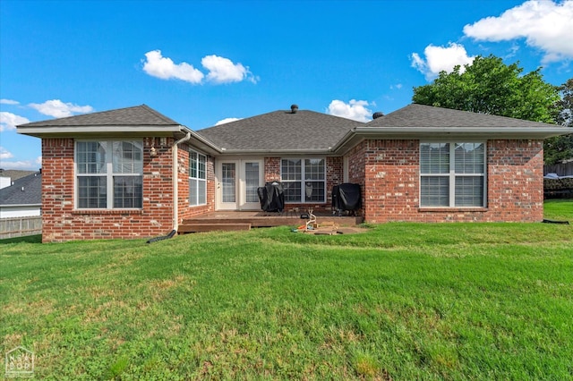 2105 Quarry Cv, Jonesboro, AR 72404 - rear view of property featuring brick siding, a lawn, and roof with shingles