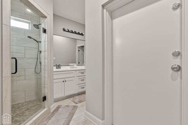 full bath with a shower stall and vanity