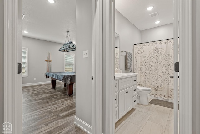 bathroom featuring pool table, vanity, visible vents, toilet, and baseboards