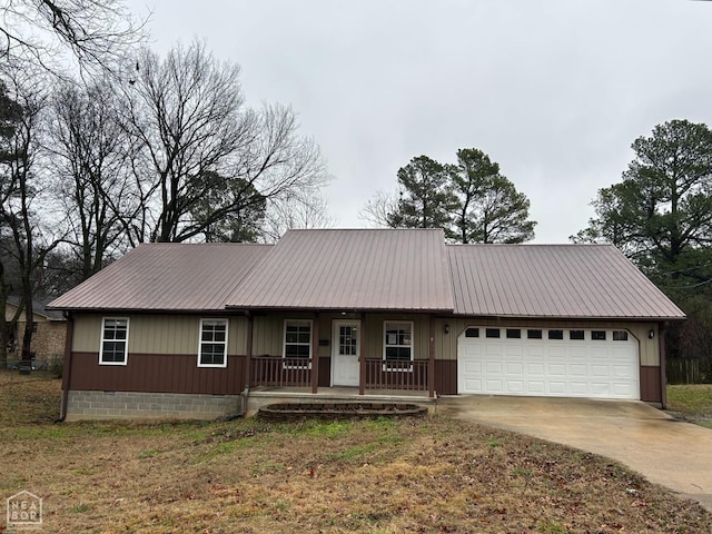 ranch-style house featuring an attached garage, concrete driveway, covered porch, and metal roof