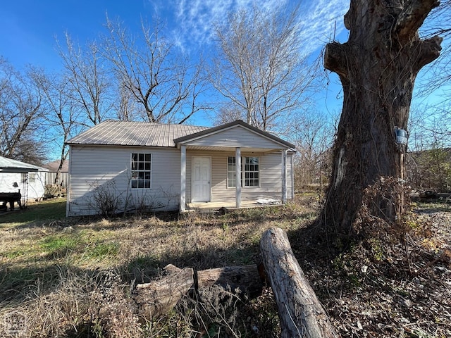 view of front of property with a porch and metal roof