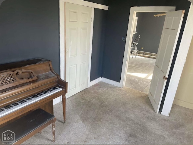 unfurnished room with baseboards and carpet